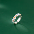 silver ring in the shape of a daisy