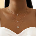 three pendant necklace with gold zirconia