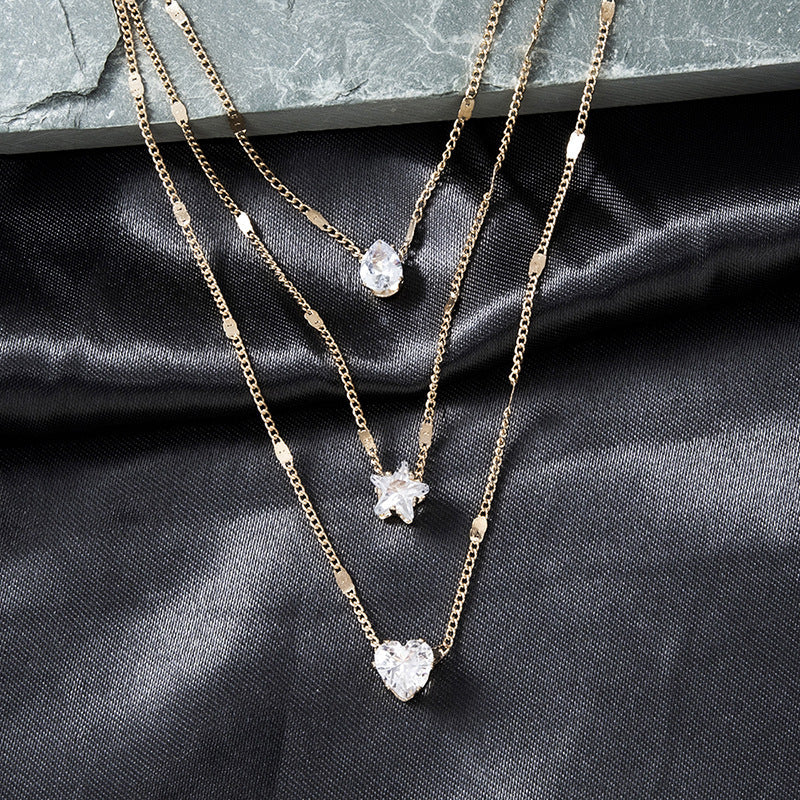 three pendant necklace with gold zirconia